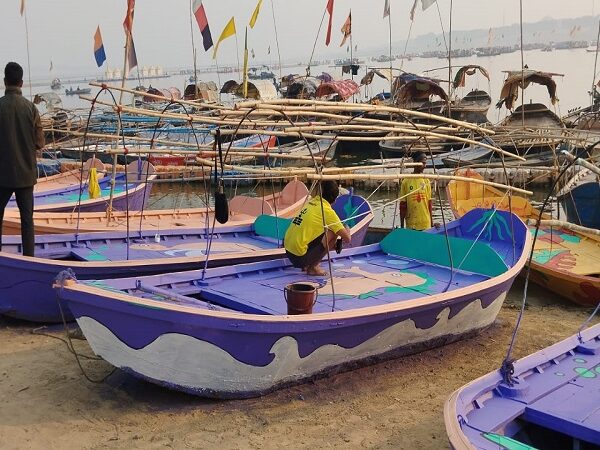 Painting being done on the boats of Sangam