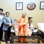 Sify Chairman Raju Vegesanane meets CM Yogi