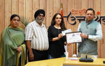 CM Dhami honored meritorious students